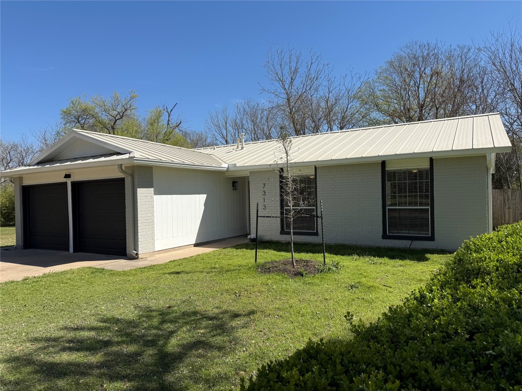 7313 Rhett Place Austin, TX 78744 - Photo 31 of 38 a view of a house with yard and plants
