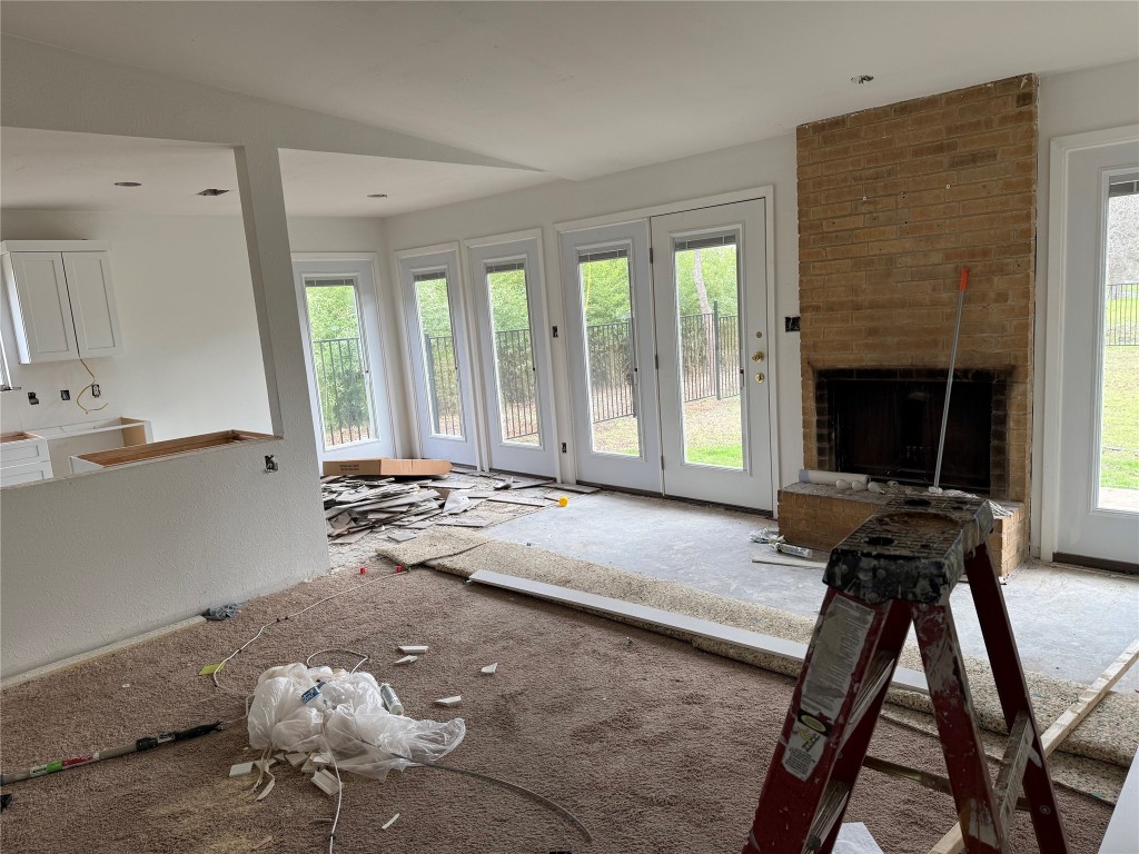 7313 Rhett Place Austin, TX 78744 - Photo 37 of 38 a living room with furniture and a fireplace