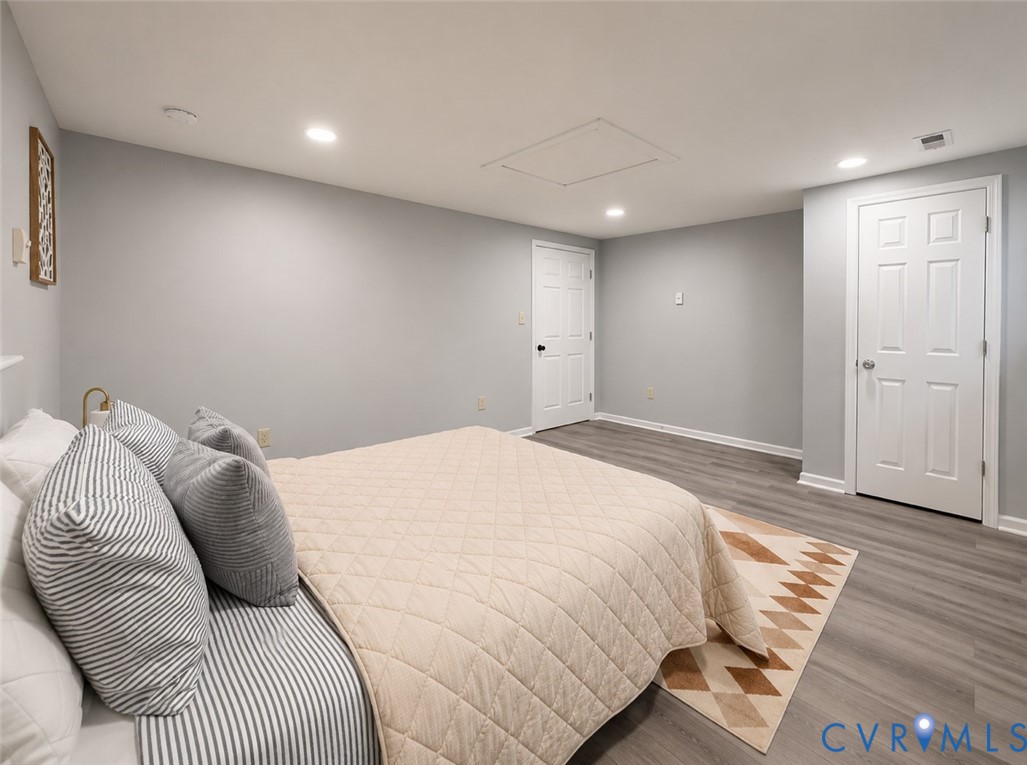 110 Locust Grove Cartersville, VA 23027 - Photo 8 of 26 a bedroom with a bed and wooden floor