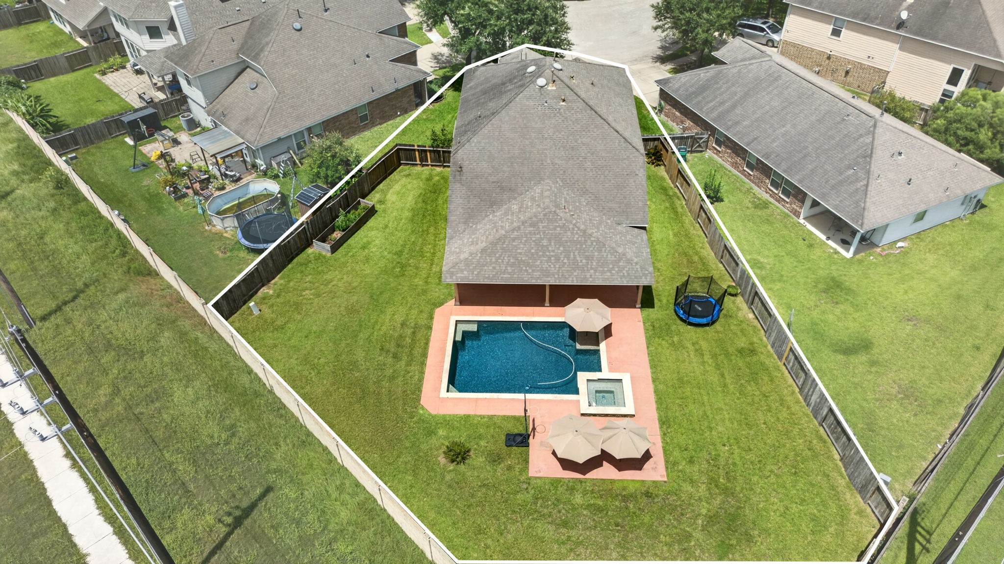 6446 Tea Tree Drive Katy, TX 77494 - Photo 2 of 39 Birds-eye view of the pie-shaped back yard with a pool!