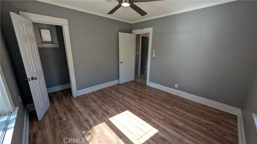 3445 4th Street Riverside, CA 92501 - Photo 11 of 20 a view of an empty room with wooden floor and a window