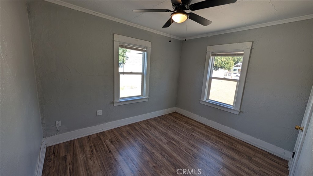 3445 4th Street Riverside, CA 92501 - Photo 12 of 20 a view of an empty room with wooden floor and a window