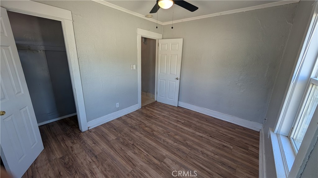 3445 4th Street Riverside, CA 92501 - Photo 13 of 20 an empty room with wooden floor and closet