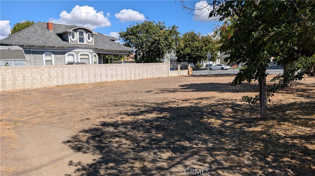 3445 4th Street Riverside, CA 92501 - Photo 19 of 20 a front view of a house with a yard