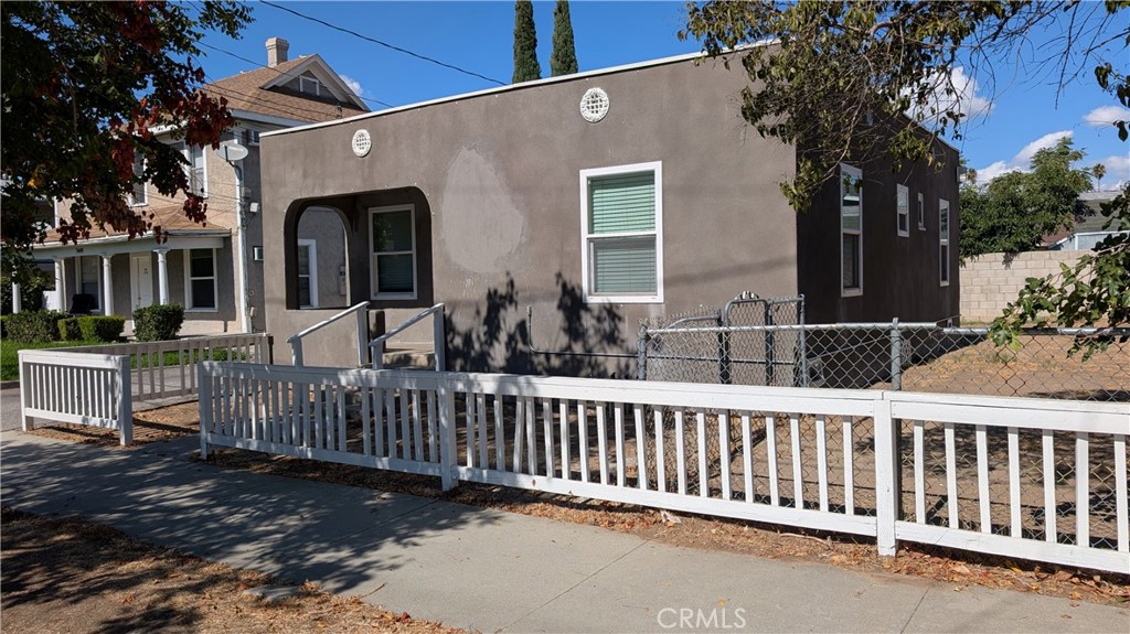 3445 4th Street Riverside, CA 92501 - Photo 3 of 20 a view of a house with wooden fence