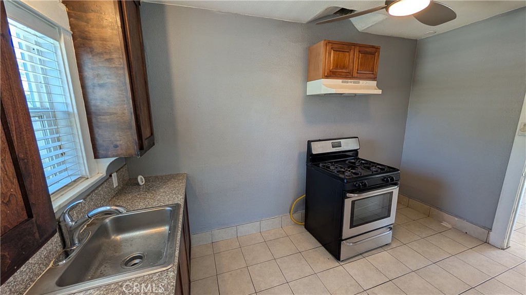 3445 4th Street Riverside, CA 92501 - Photo 7 of 20 a bathroom with a sink toilet and mirror