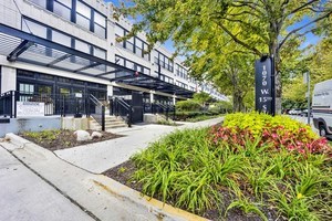 1070 West 15th Street, Unit 112 Chicago, IL 60608 - Photo 1 of 29 a view of a building with a garden