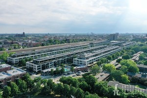 1070 West 15th Street, Unit 112 Chicago, IL 60608 - Photo 25 of 29 an aerial view of a house with a yard