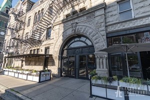 1070 West 15th Street, Unit 112 Chicago, IL 60608 - Photo 27 of 29 a view of a building with a couple of people