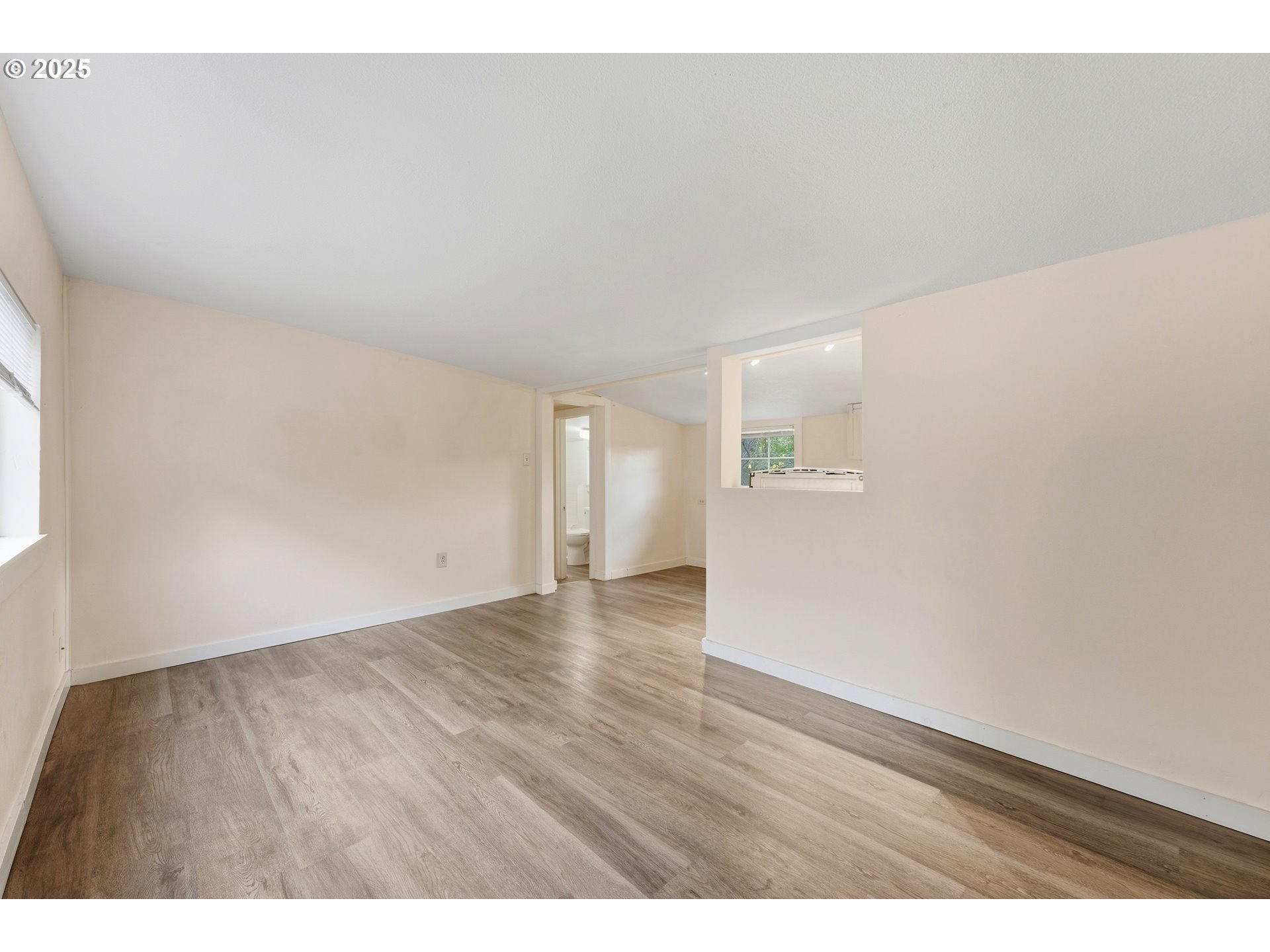 327 Powell Road Milton Freewater, OR 97862 - Photo 14 of 48 a view of an empty room and wooden floor