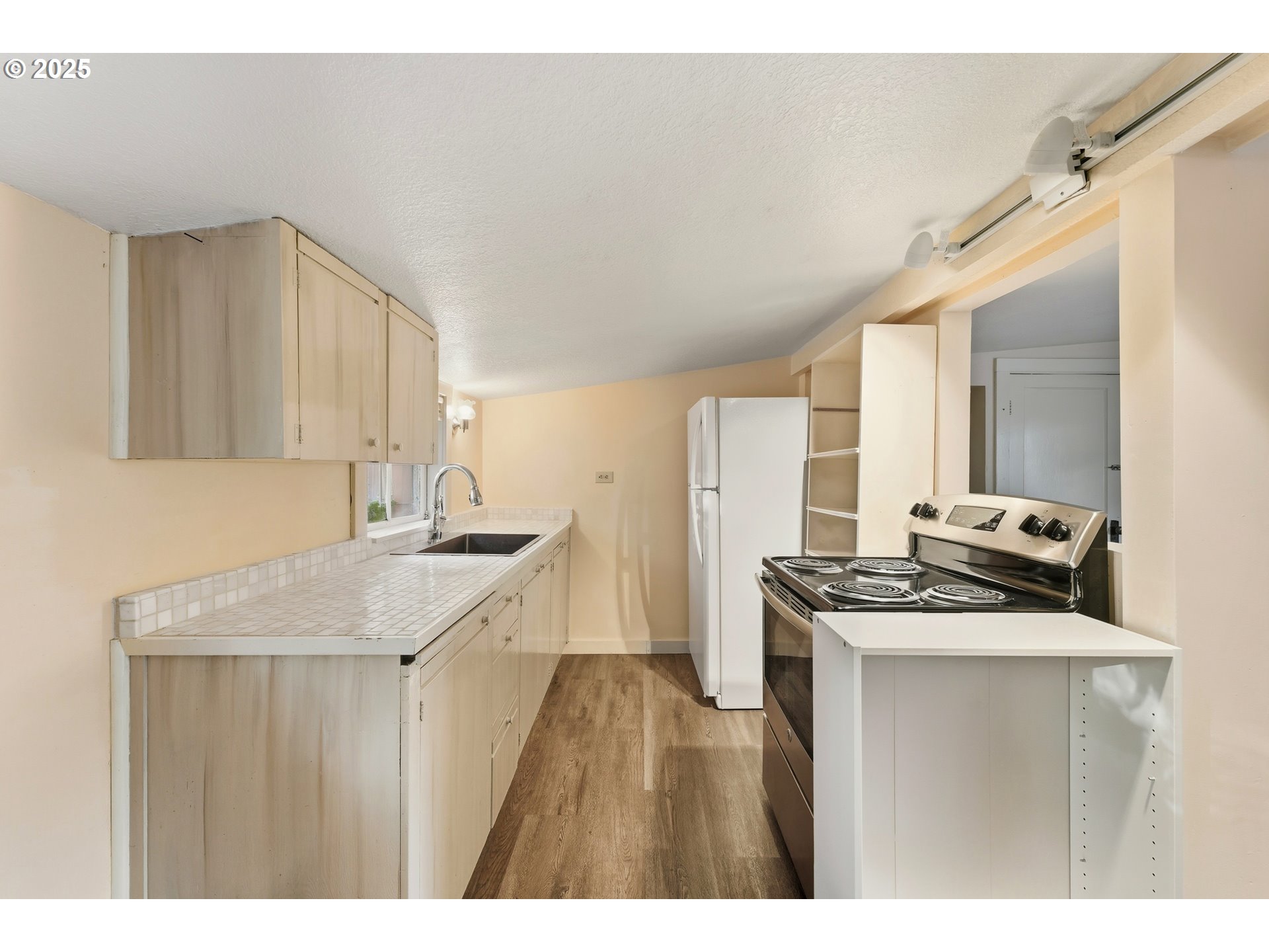 327 Powell Road Milton Freewater, OR 97862 - Photo 17 of 48 a kitchen with a sink stove and cabinets