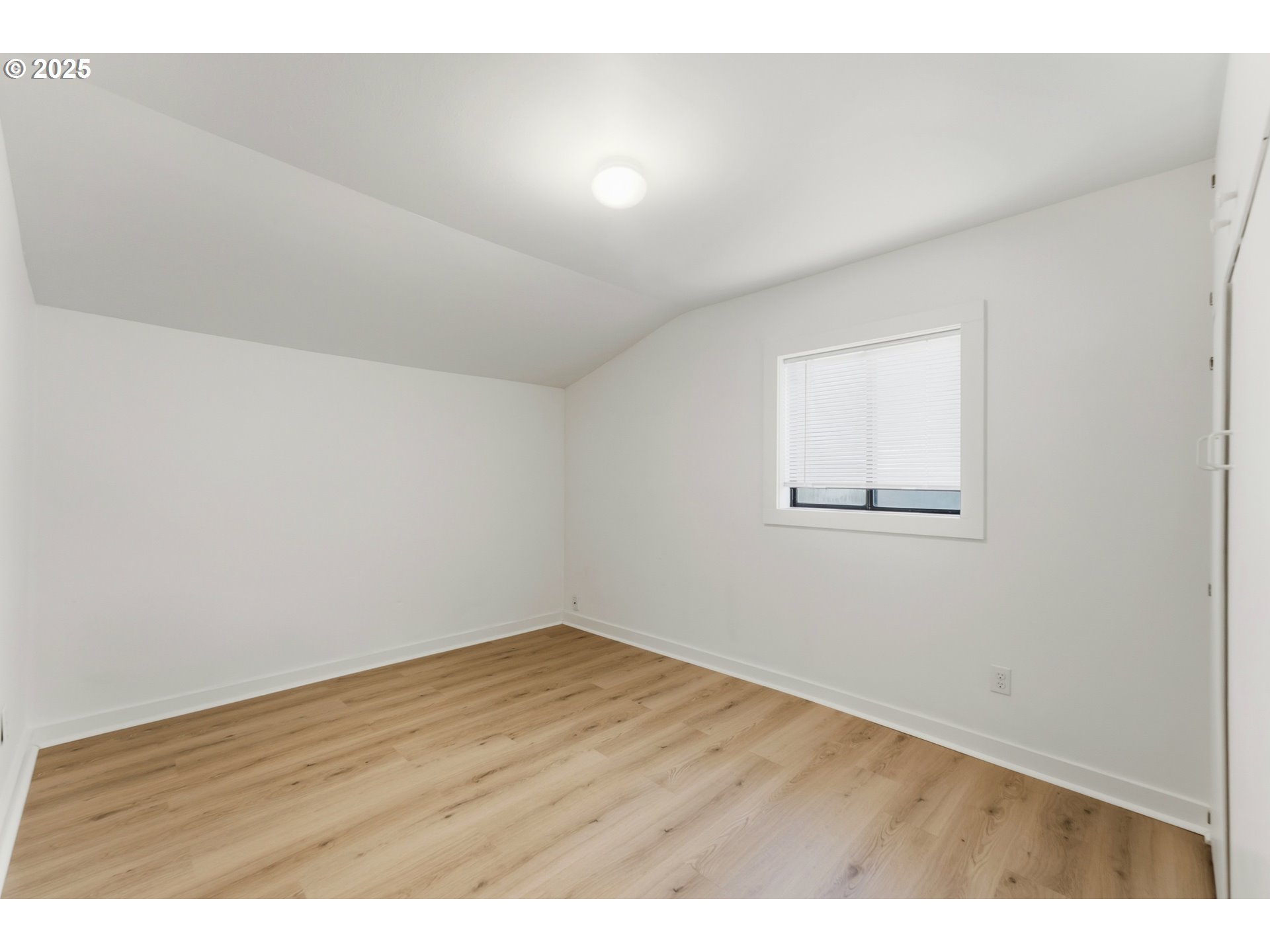 327 Powell Road Milton Freewater, OR 97862 - Photo 35 of 48 an empty room with wooden floor and windows