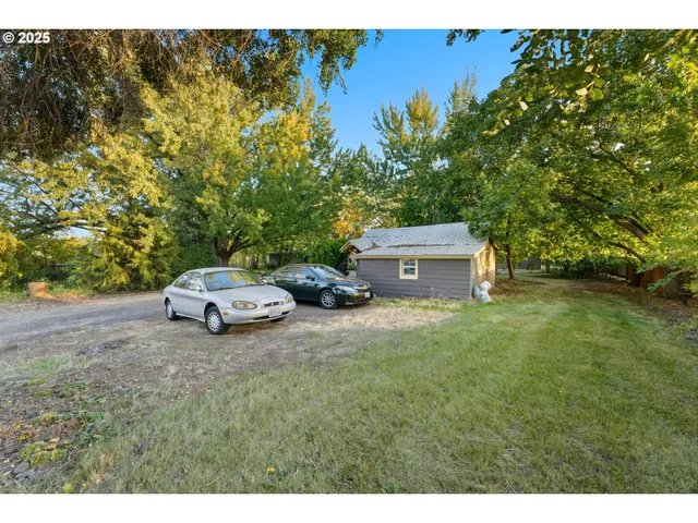 a view of a two chairs in a yard