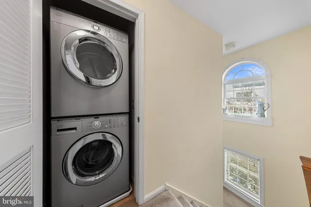 a view of a hallway with washer and dryer