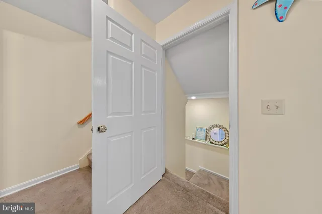 a view of front door with a mirror