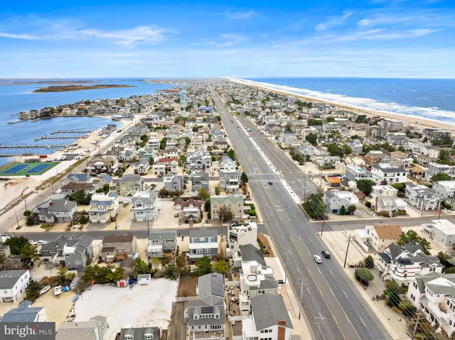 an aerial view of a building with an ocean view