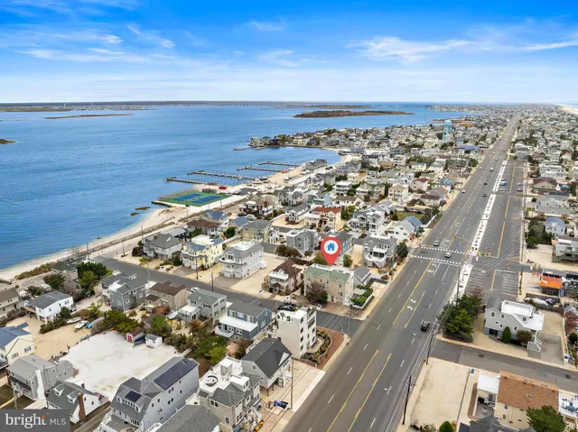 an aerial view of multiple houses with outdoor space