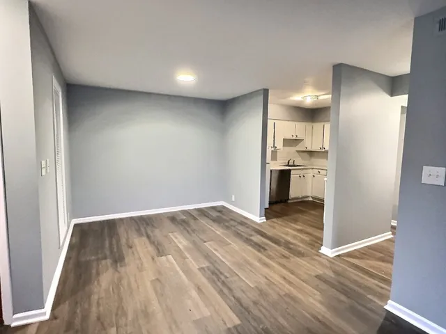 a kitchen with a refrigerator sink and cabinets