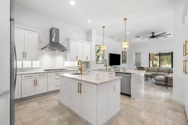 a large kitchen with a table and chairs