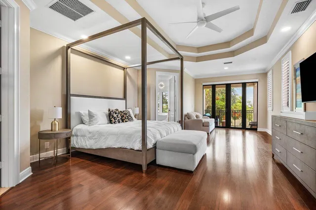 a bedroom with a bed lamp closet and window
