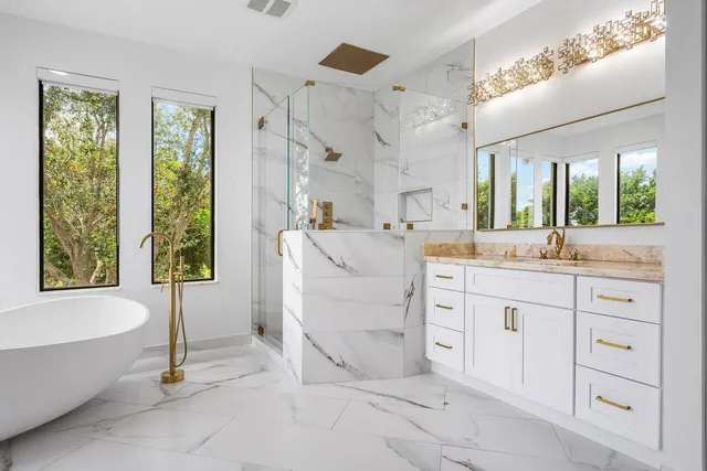 a spacious bathroom with a double vanity sink and a mirror