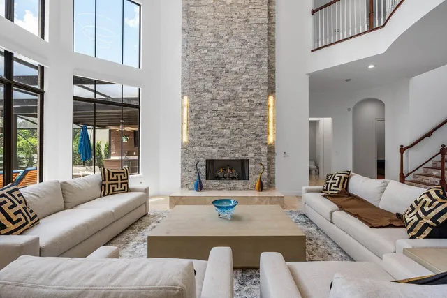 a living room with furniture and fireplace