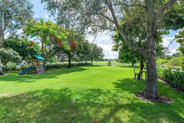 a view of a house with a big yard