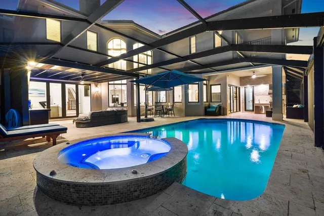 a view of a swimming pool with a patio