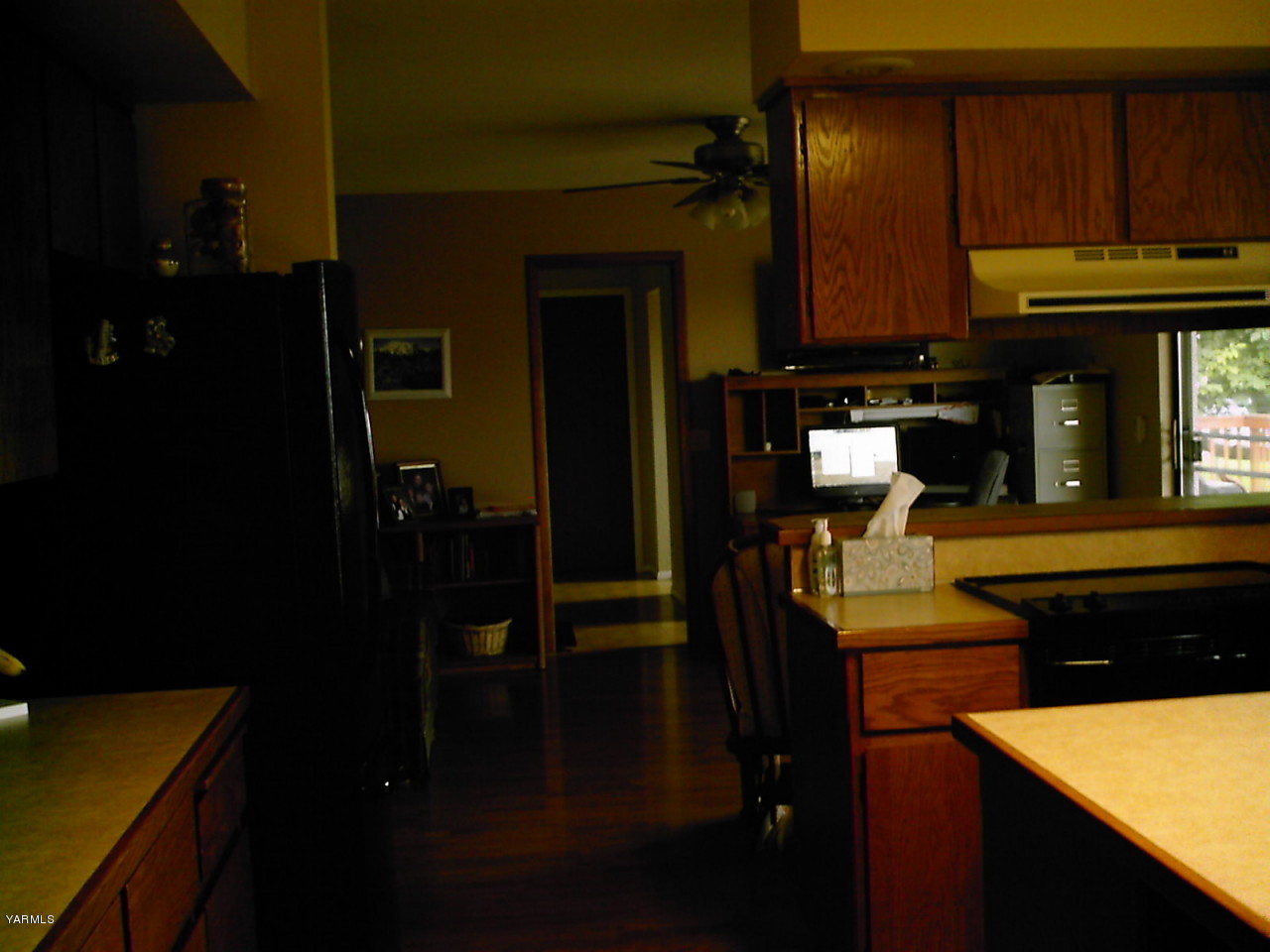 41 Roza Road Grandview, WA 98930 - Photo 3 of 7 a kitchen with refrigerator and cabinets