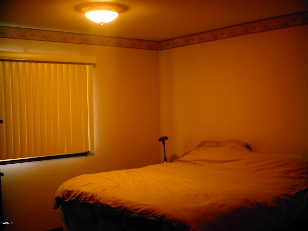 41 Roza Road Grandview, WA 98930 - Photo 5 of 7 a bedroom with a bed and a window