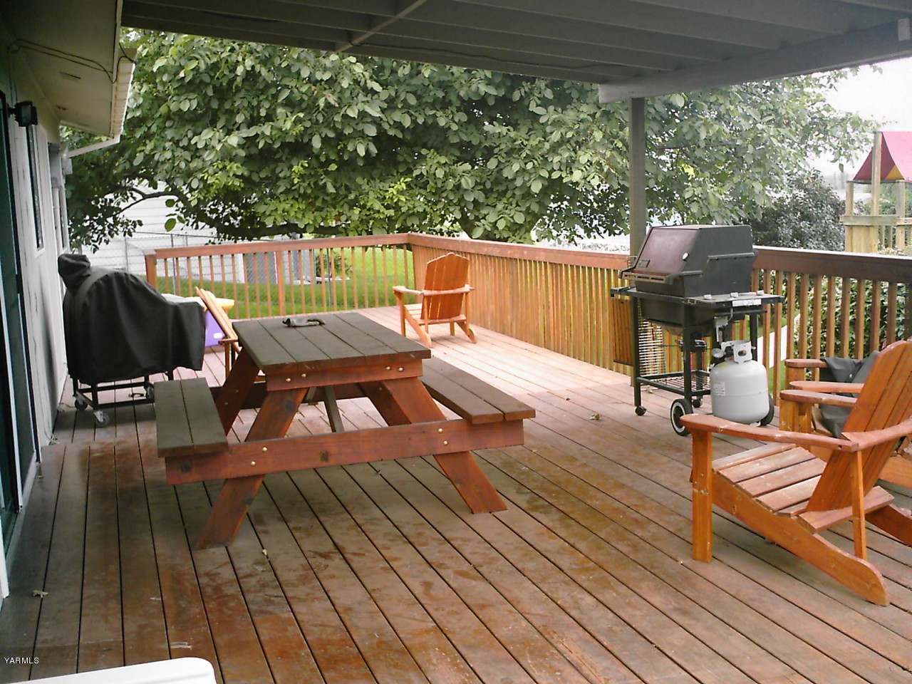 41 Roza Road Grandview, WA 98930 - Photo 7 of 7 a view of a deck with wooden floor and outdoor seating