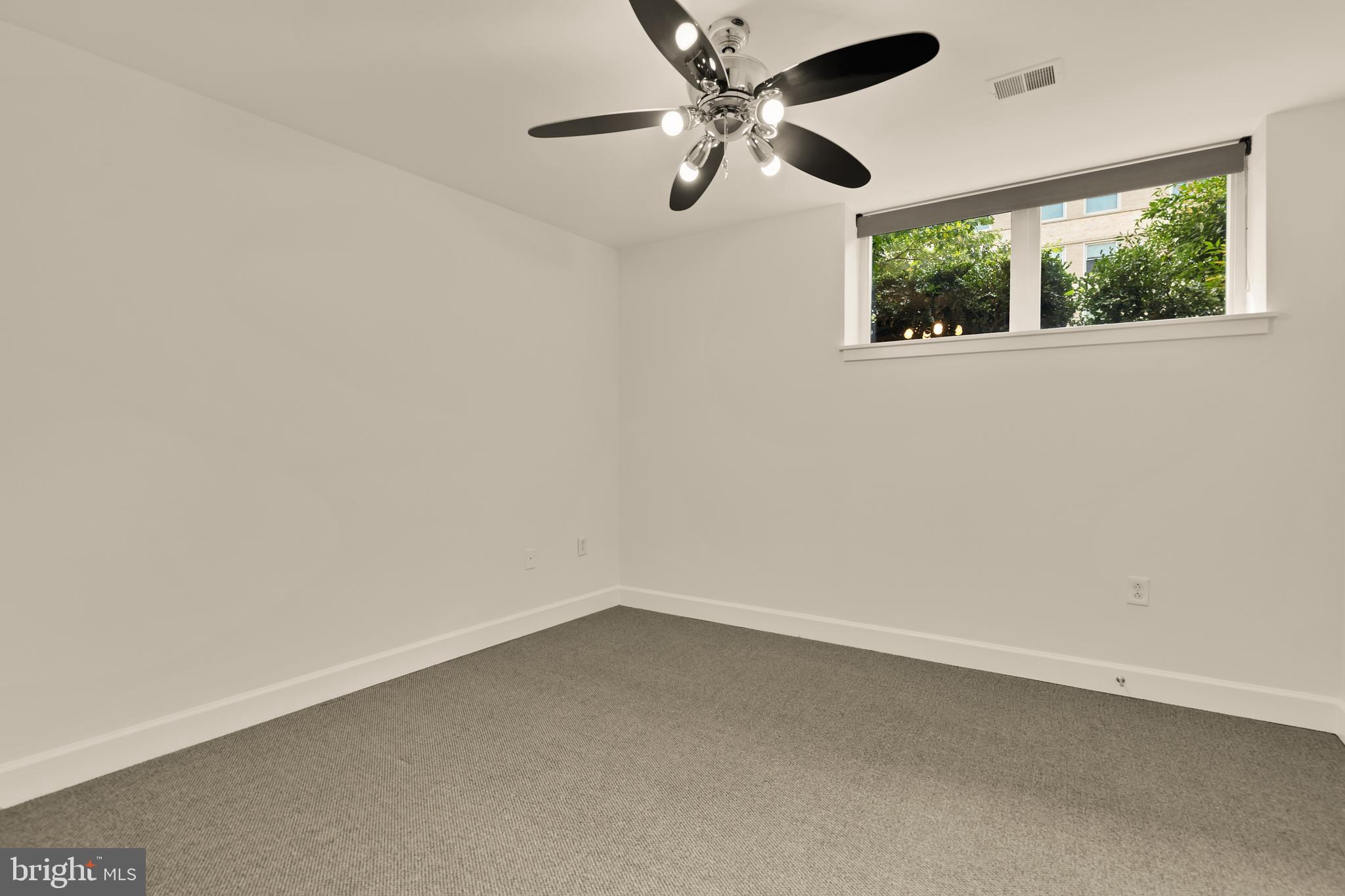 150 V Street Northwest, Unit VL02 Washington, DC 20001 - Photo 9 of 18 an empty room with a window