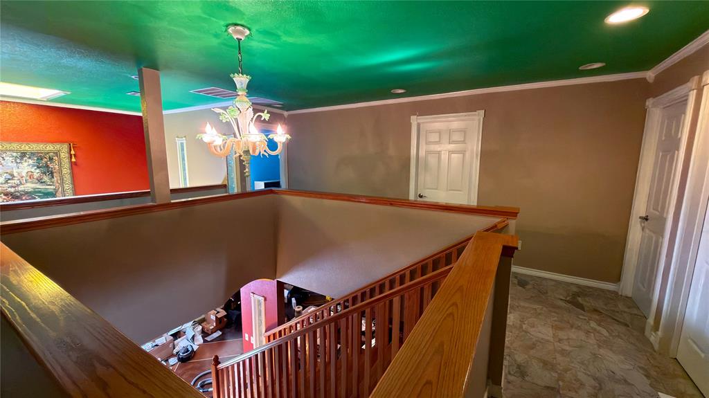 2900 Robinson Road Denton, TX 76210 - Photo 16 of 33 Hardwood staircase with traditional spindles and handrail