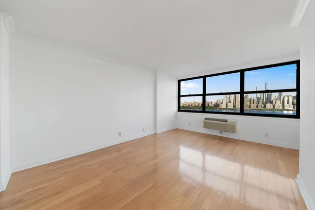 a view of a living room with a large window