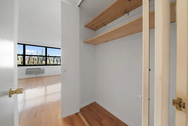 a bathroom with a double vanity sink mirror and shower