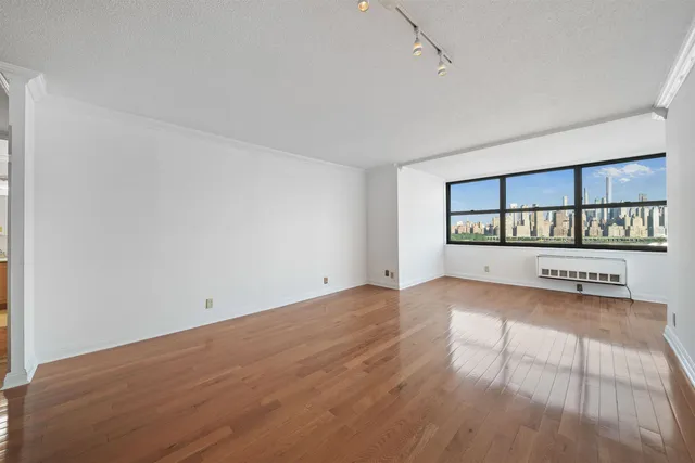 a view of a room with racks on the wall and a window