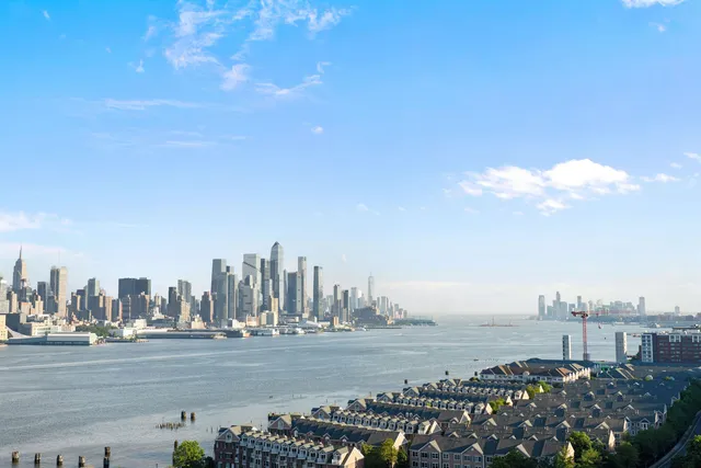 a view of a city with lots of ocean