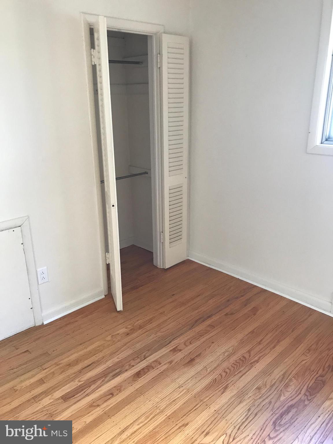 720 Yale Road Bala Cynwyd, PA 19004 - Photo 16 of 25 an empty room with wooden floor and entrance