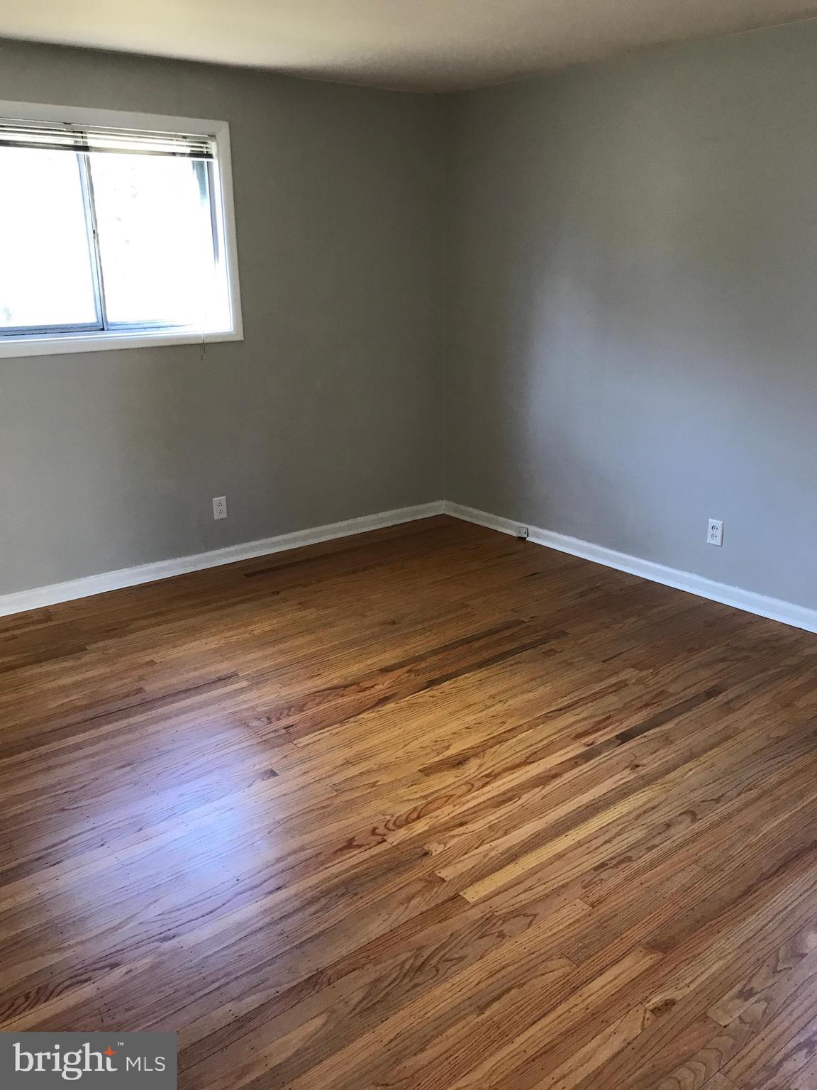 720 Yale Road Bala Cynwyd, PA 19004 - Photo 19 of 25 a view of an empty room with wooden floor and a window