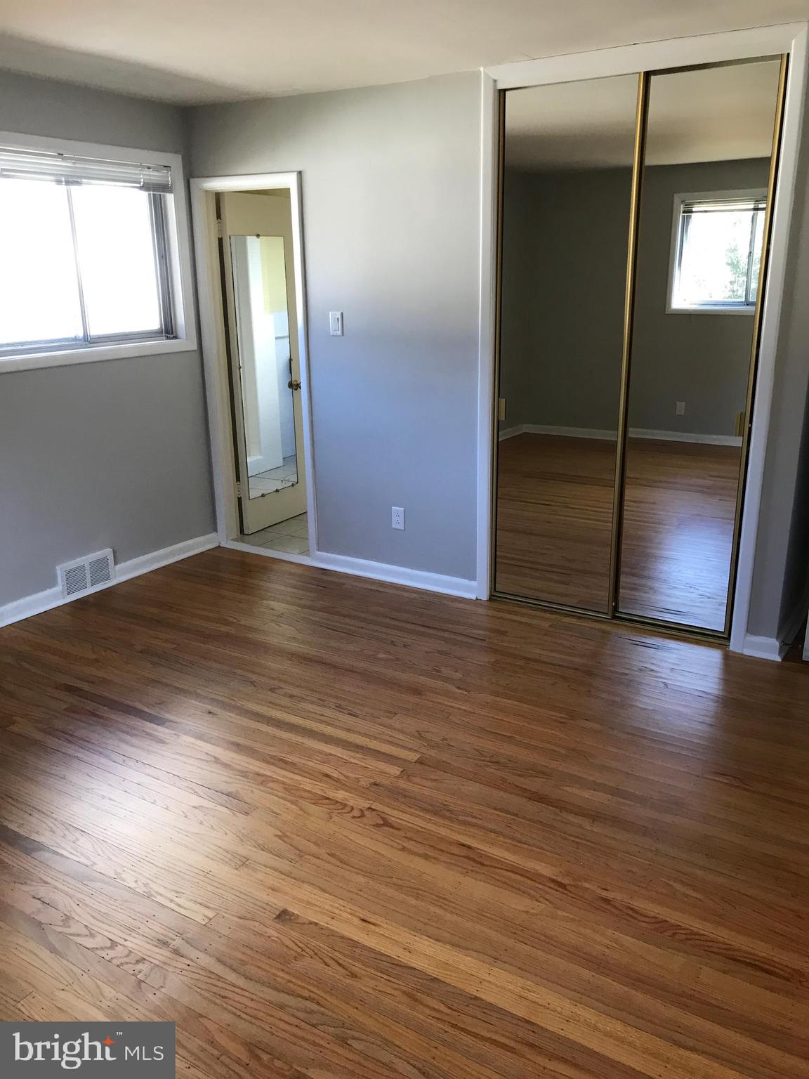 720 Yale Road Bala Cynwyd, PA 19004 - Photo 20 of 25 an empty room with wooden floor and closet