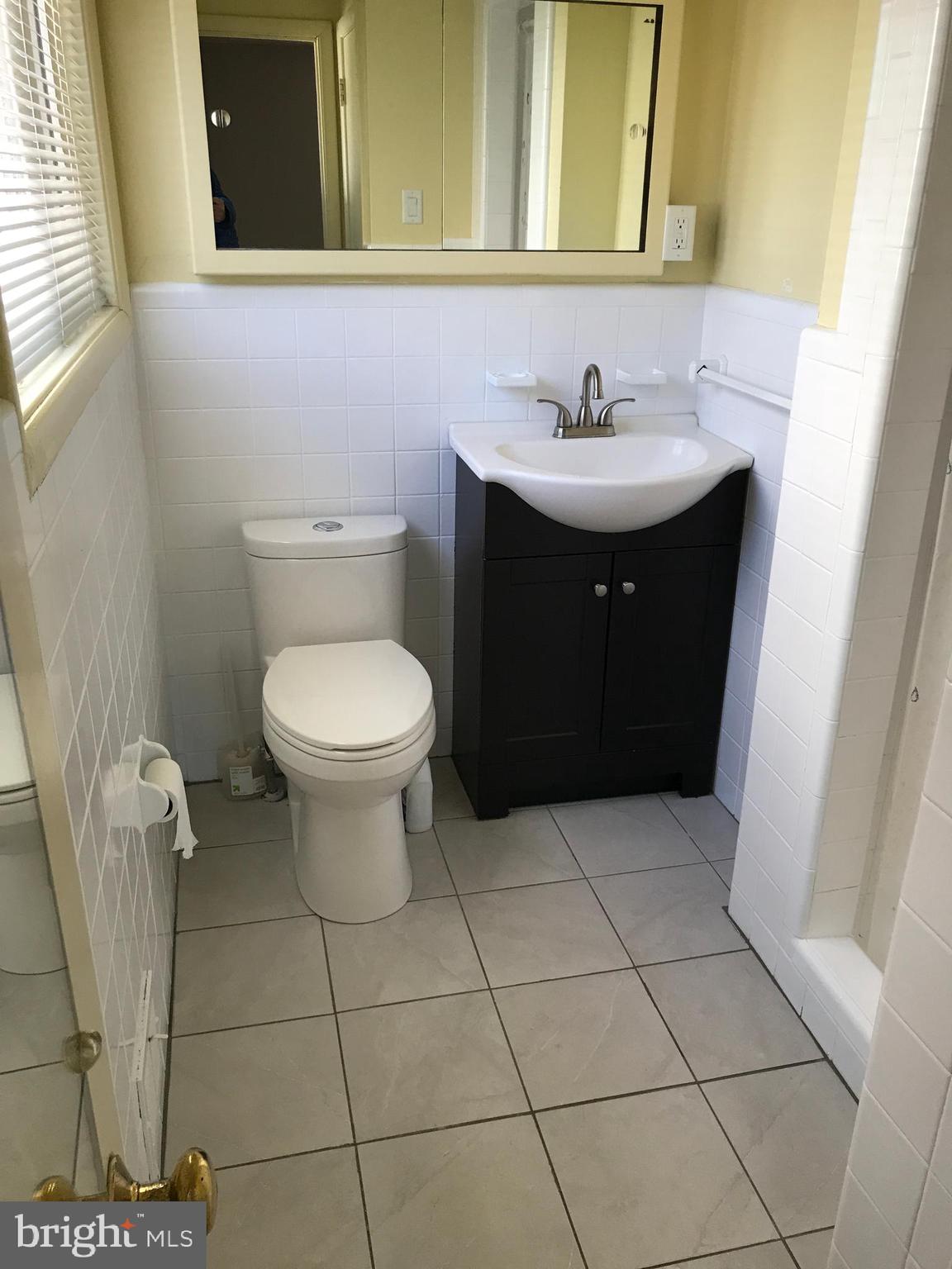 720 Yale Road Bala Cynwyd, PA 19004 - Photo 21 of 25 a bathroom with a sink a toilet and a mirror