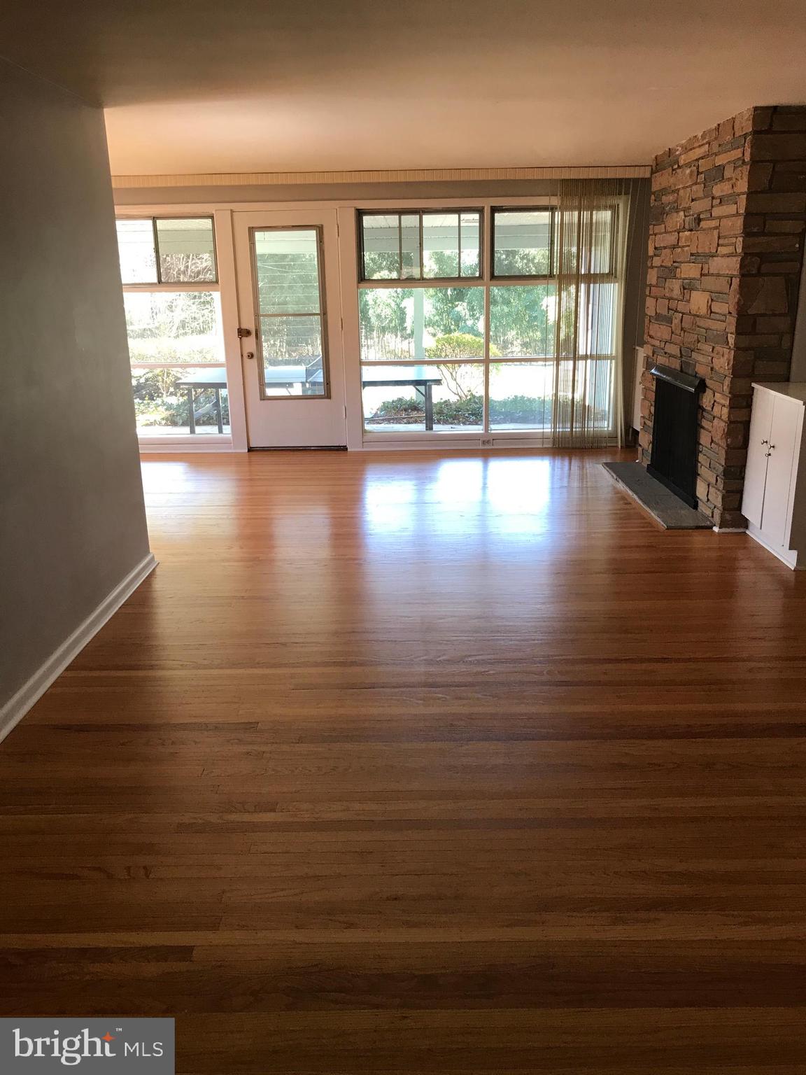 720 Yale Road Bala Cynwyd, PA 19004 - Photo 3 of 25 a view of an empty room with wooden floor and a window