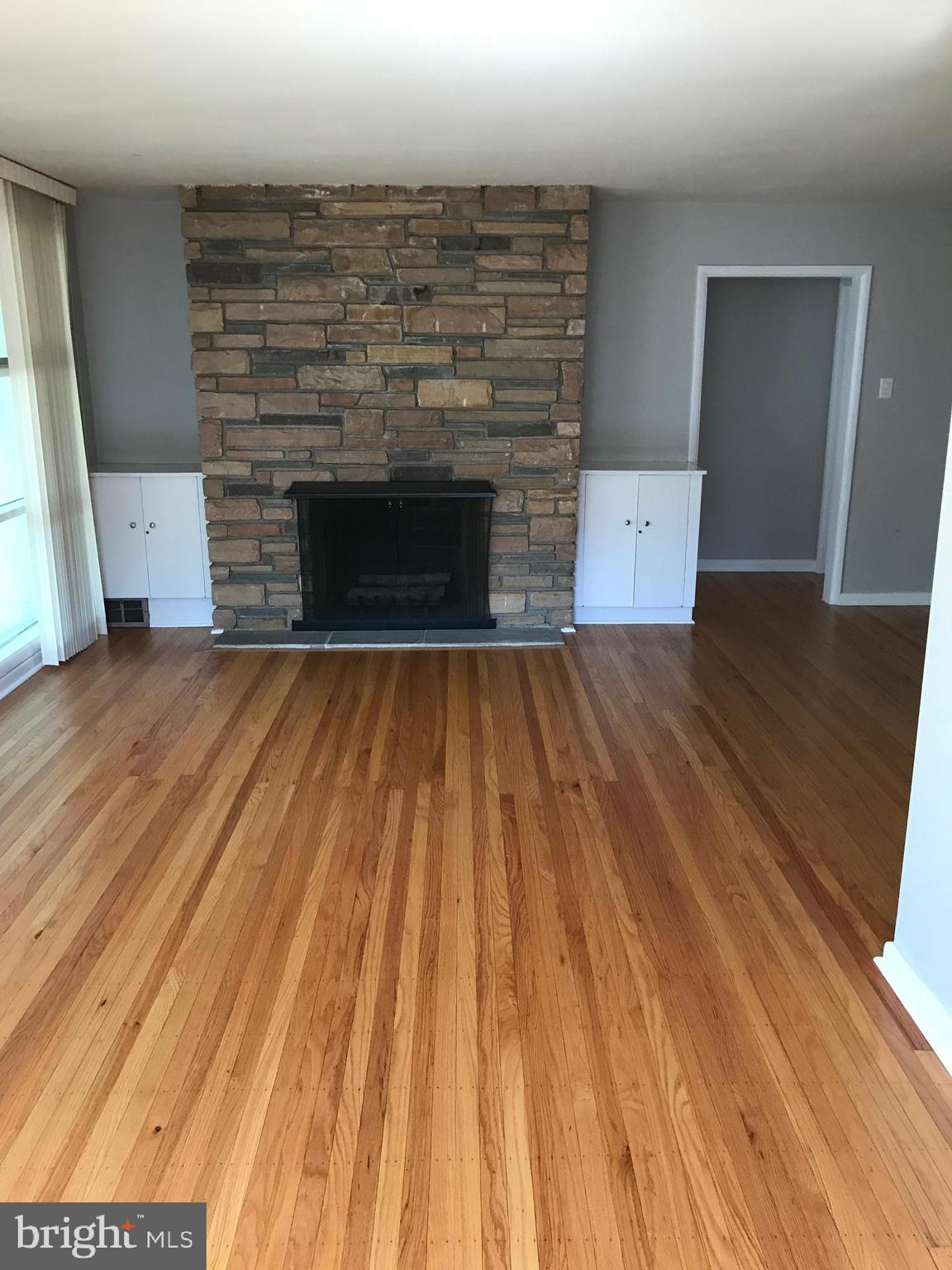 720 Yale Road Bala Cynwyd, PA 19004 - Photo 4 of 25 a view of empty room with wooden floor and fireplace