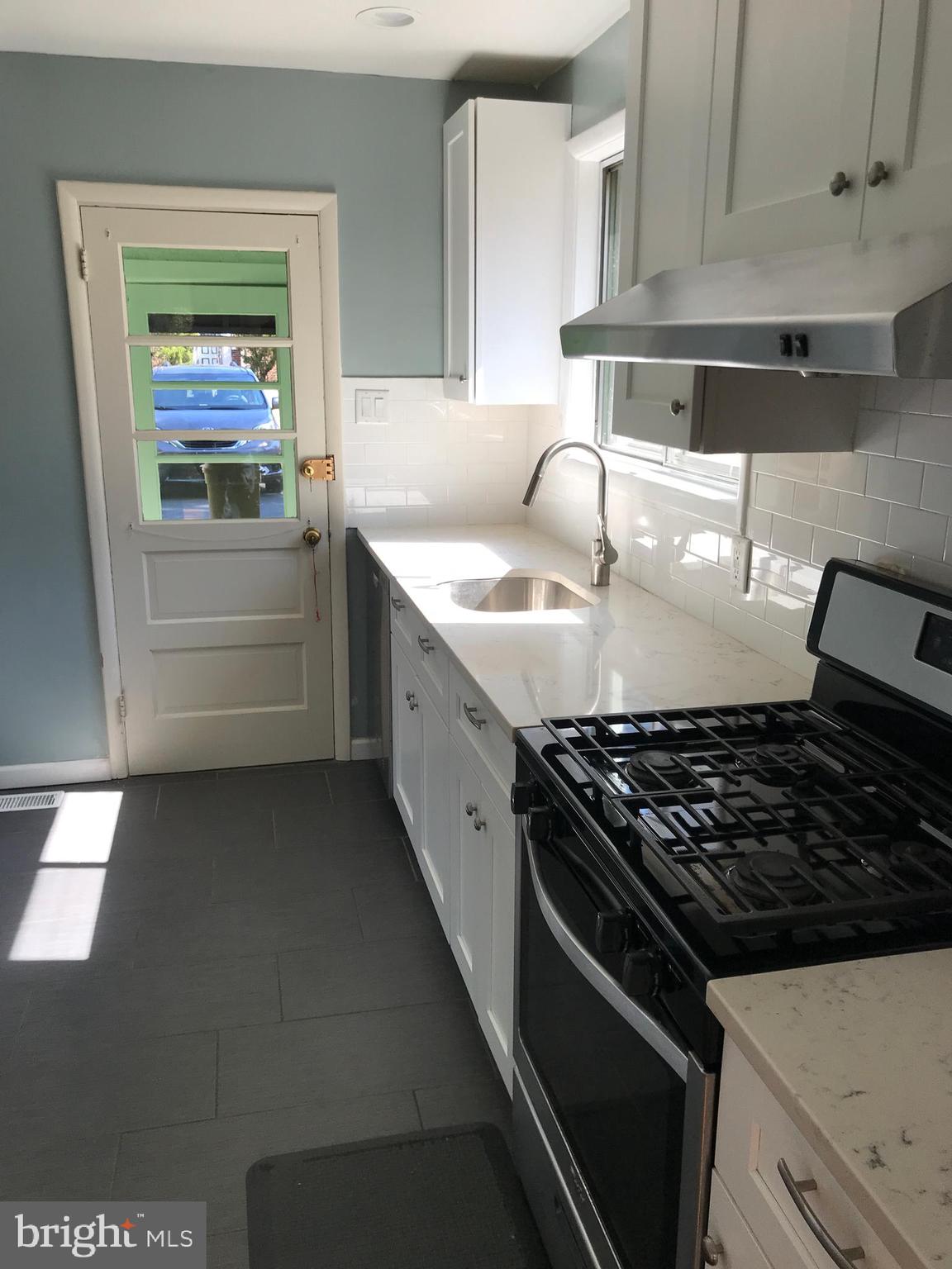720 Yale Road Bala Cynwyd, PA 19004 - Photo 8 of 25 a kitchen with granite countertop a stove and a sink