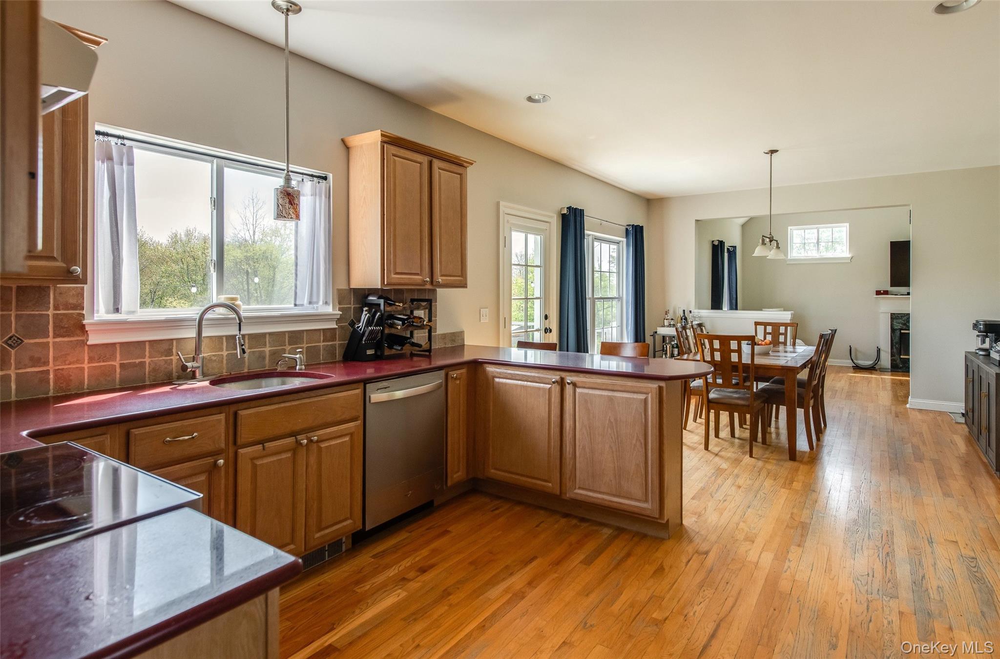 66 Gretna Road Pleasant Valley, NY 12569 - Photo 14 of 37 a kitchen with sink cabinets and dining table