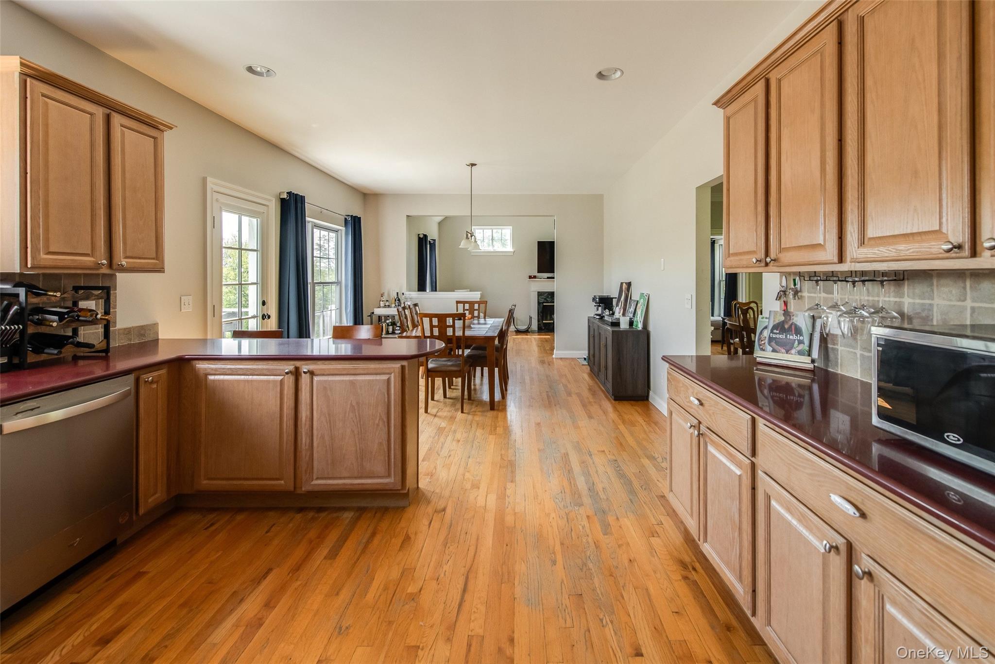 66 Gretna Road Pleasant Valley, NY 12569 - Photo 16 of 37 a kitchen with stainless steel appliances granite countertop wooden cabinets a refrigerator a sink a stove and a wooden floors