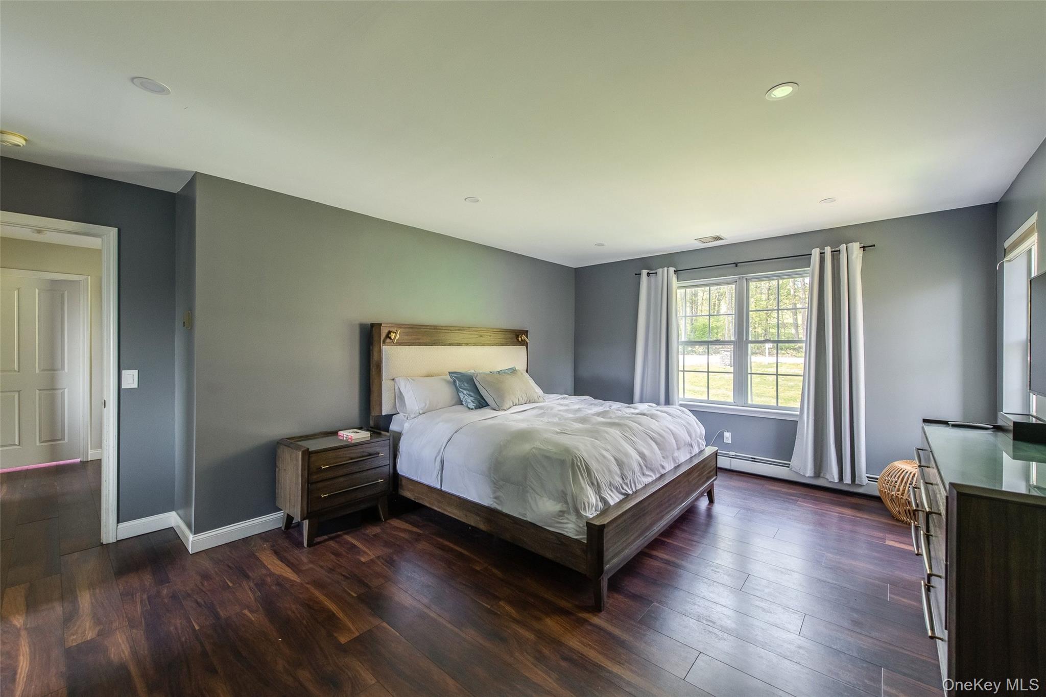 66 Gretna Road Pleasant Valley, NY 12569 - Photo 19 of 37 a bedroom with a bed and wooden floor