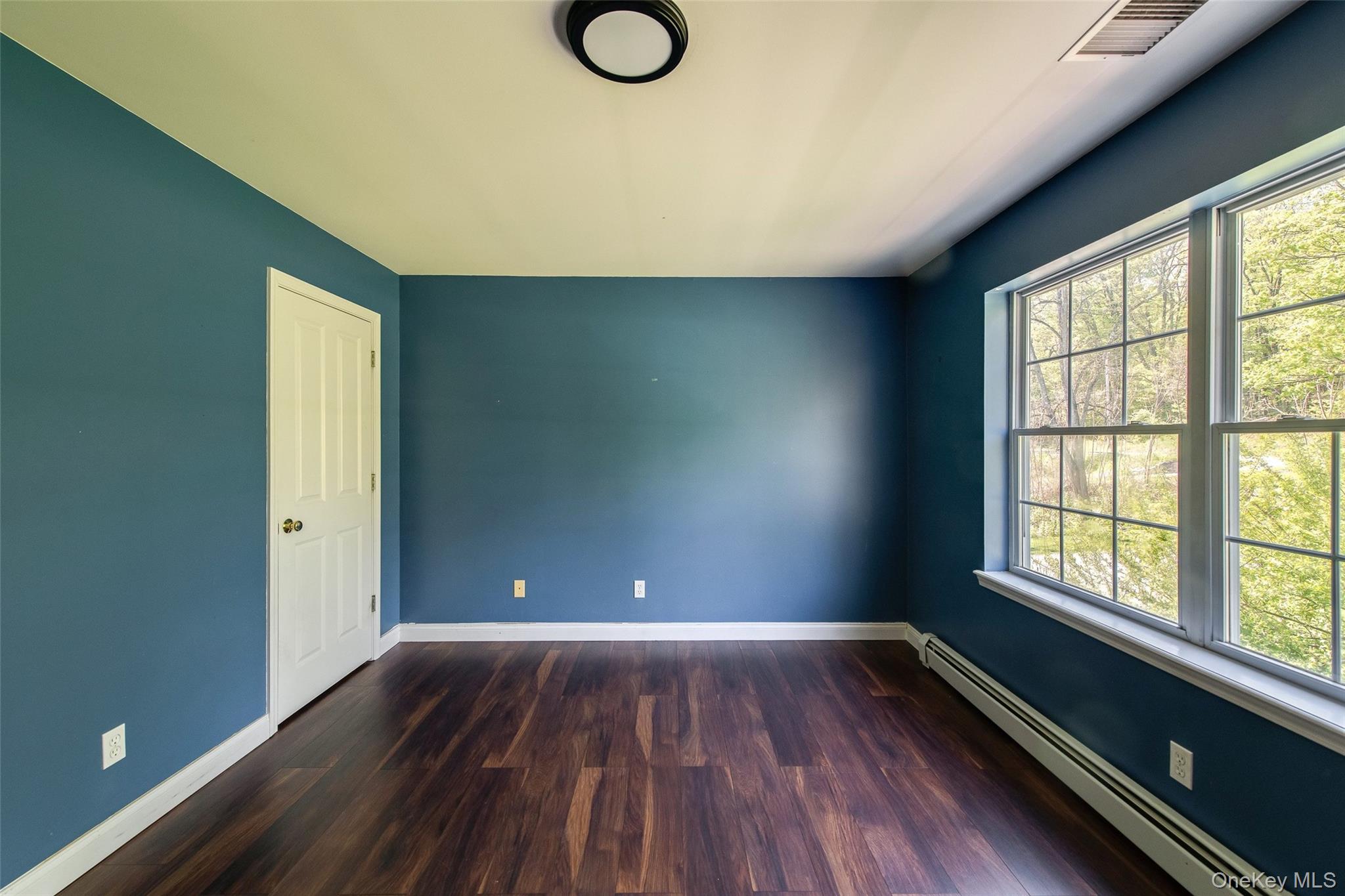 66 Gretna Road Pleasant Valley, NY 12569 - Photo 24 of 37 an empty room with wooden floor and windows