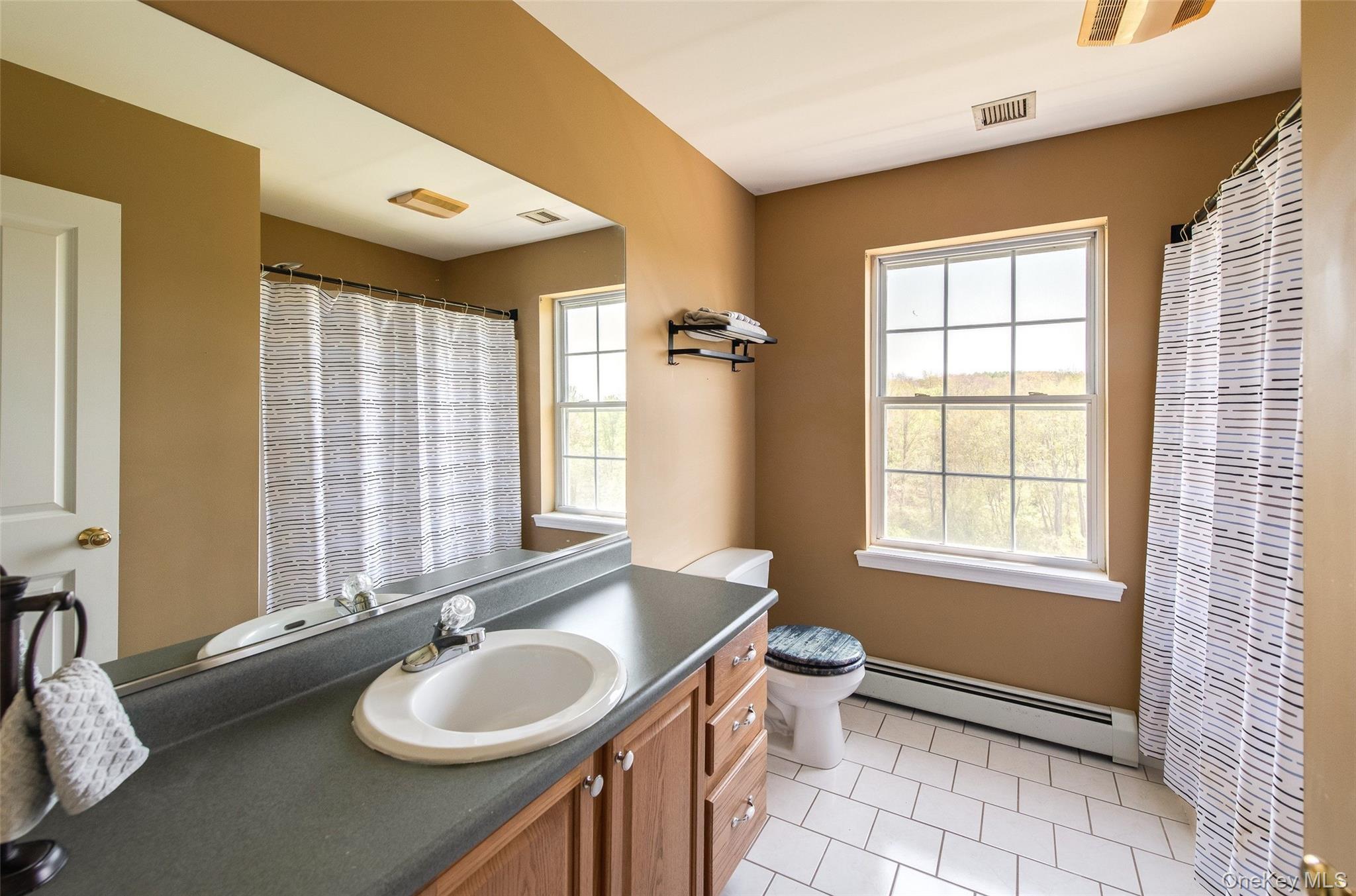 66 Gretna Road Pleasant Valley, NY 12569 - Photo 26 of 37 a bathroom with a granite countertop sink toilet and mirror