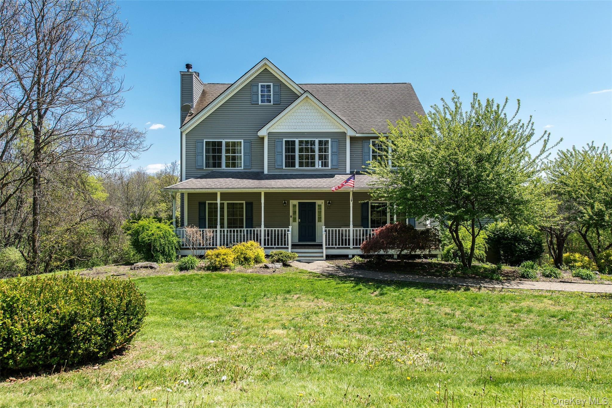 66 Gretna Road Pleasant Valley, NY 12569 - Photo 37 of 37 a front view of a house with a yard table and chairs